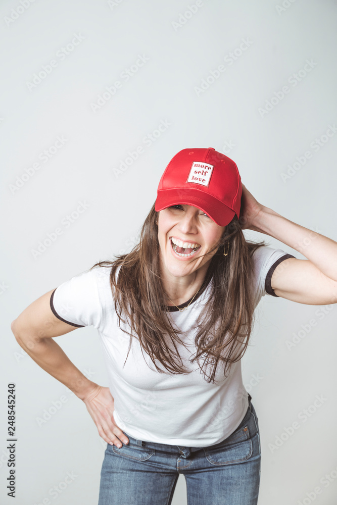 Happy beautiful woman with red hat in studio Happy beautiful woman with red hat in studio