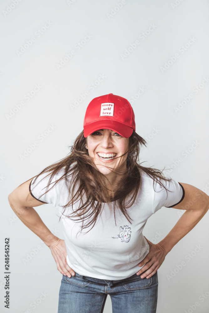 Happy beautiful woman with red hat in studio Happy beautiful woman with red hat in studio