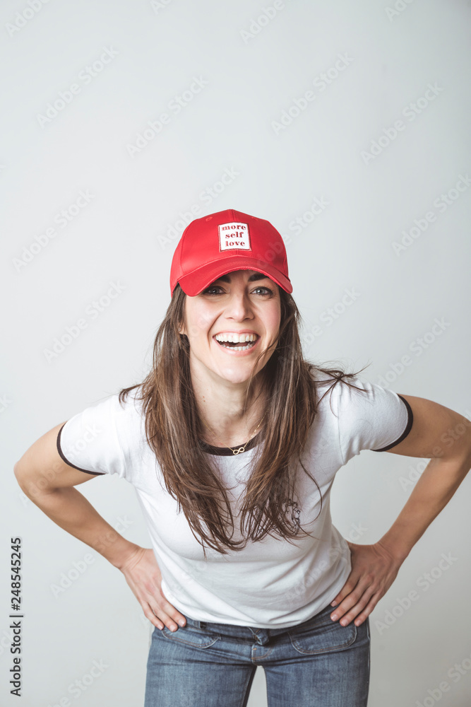 Happy beautiful woman with red hat in studio Happy beautiful woman with red hat in studio