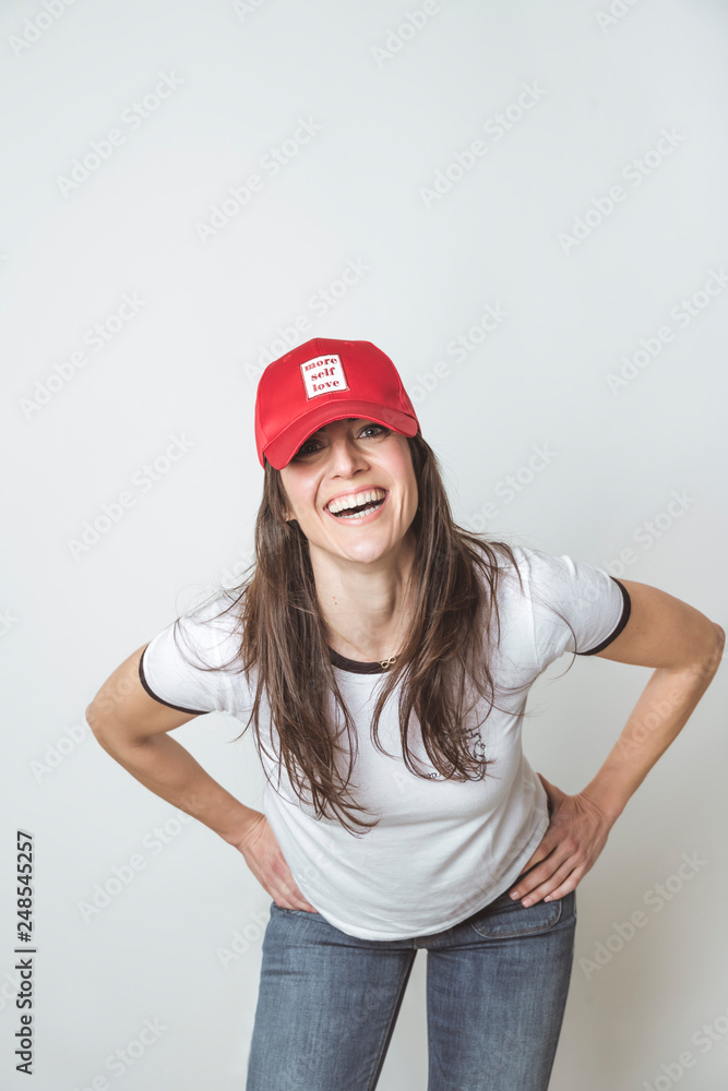 Happy beautiful woman with red hat in studio Happy beautiful woman with red hat in studio
