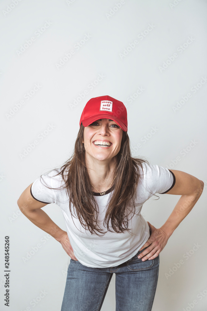 Happy beautiful woman with red hat in studio Happy beautiful woman with red hat in studio