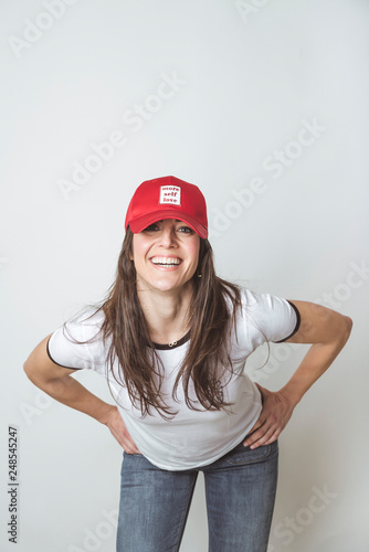Happy beautiful woman with red hat in studio