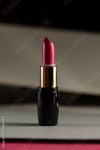 Pink lipstick on modern background. Product and make up concept