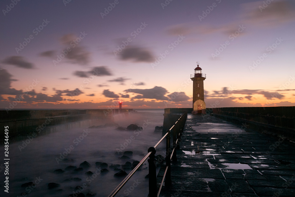 Lighthouse at the Douro mouth in Porto at sunset
