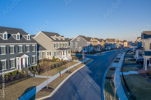 Aerial view of American luxury traditional, contemporary single family homes with gable roof, in a new residential suburban neighborhood, for upper middle class families in the USA