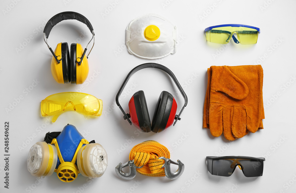 Flat lay composition with safety equipment on white background - obrazy, fototapety, plakaty 