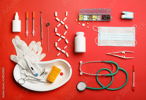 Flat lay composition with medical objects on color background