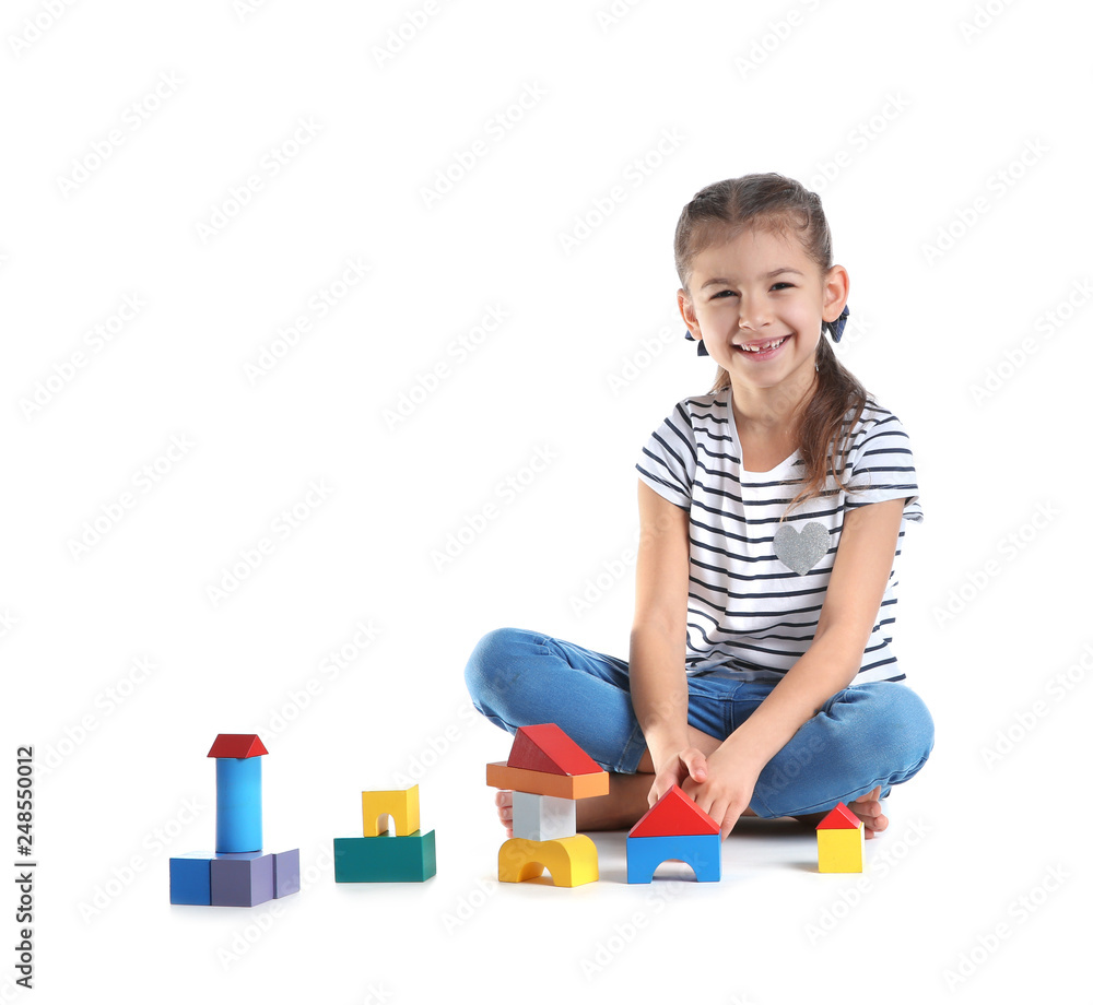 Cute child playing with colorful blocks on white background Cute child playing with colorful blocks on white background