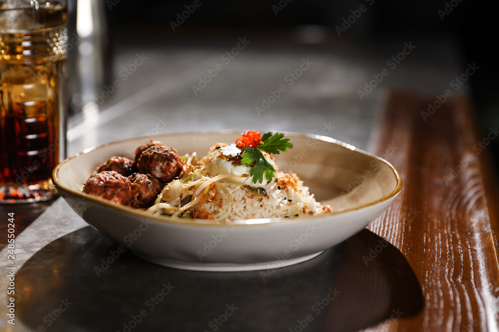Plate with rice and meat balls served on table Plate with rice and meat balls served on table
