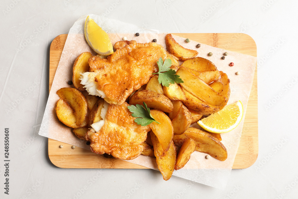 British traditional fish and potato chips on table, top view
