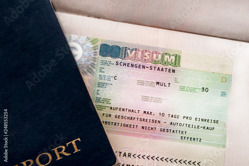 Two travelers passports with a Schengen visa. Euro-trip. Selective focus. photo