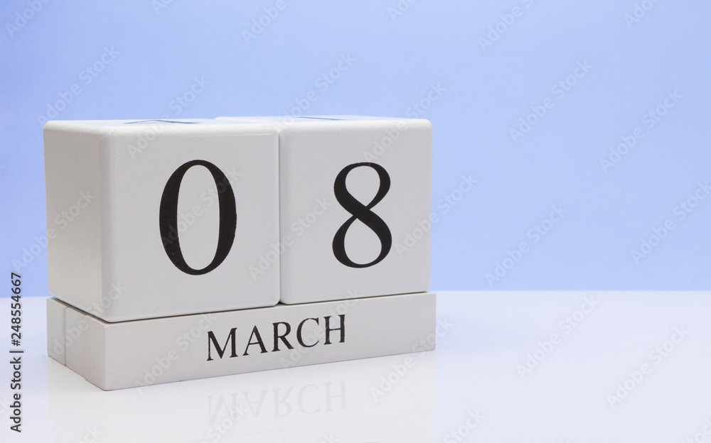 March 08st. Day 08 of month, daily calendar on white table with reflection, with light blue background. Spring time, empty space for text March 08st. Day 08 of month, daily calendar on white table with reflection, with light blue background. Spring time, empty space for text