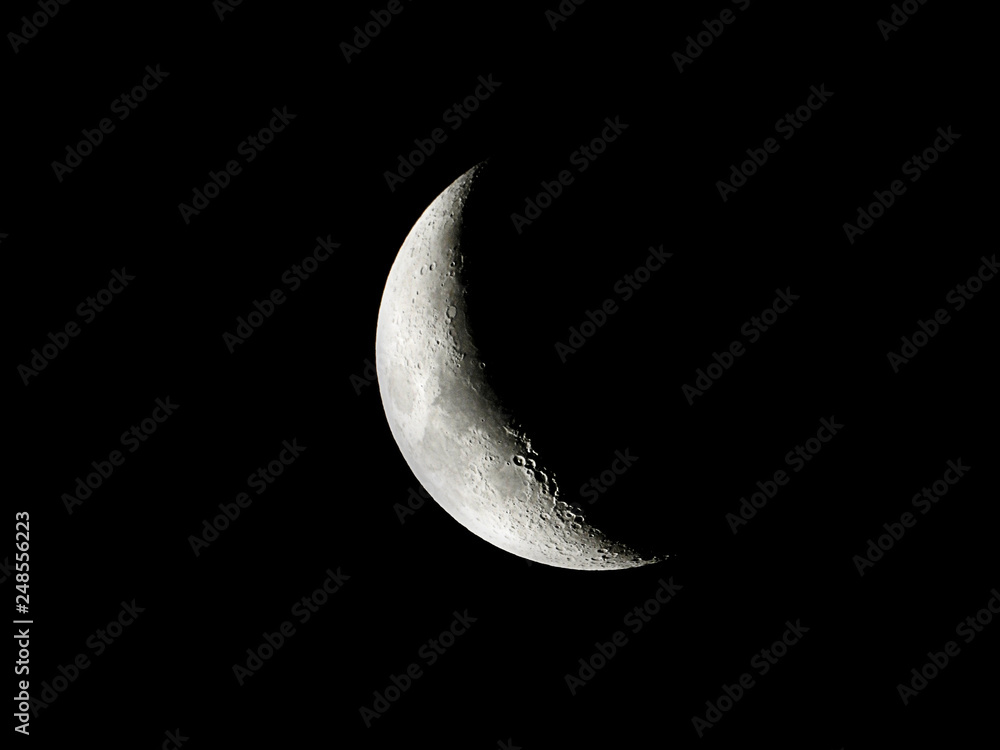 Crescent Moon / The Moon as it appears early in its first quarter or late in its last quarter, when only a small arc-shaped section of the visible portion is illuminated by the Sun Crescent Moon / The Moon as it appears early in its first quarter or late in its last quarter, when only a small arc-shaped section of the visible portion is illuminated by the Sun