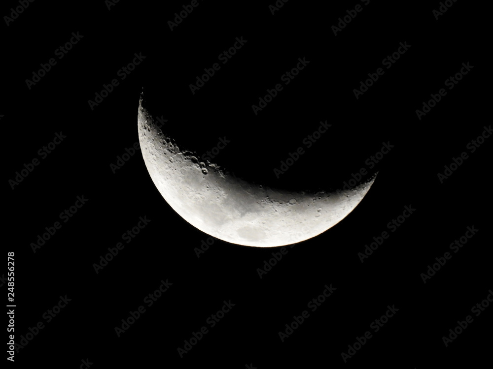 Crescent Moon / The Moon as it appears early in its first quarter or late in its last quarter, when only a small arc-shaped section of the visible portion is illuminated by the Sun Crescent Moon / The Moon as it appears early in its first quarter or late in its last quarter, when only a small arc-shaped section of the visible portion is illuminated by the Sun