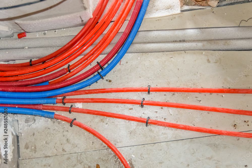 Tubes of the underfloor heating system on a styrofoam insulation Tubes of the underfloor heating system on a styrofoam insulation