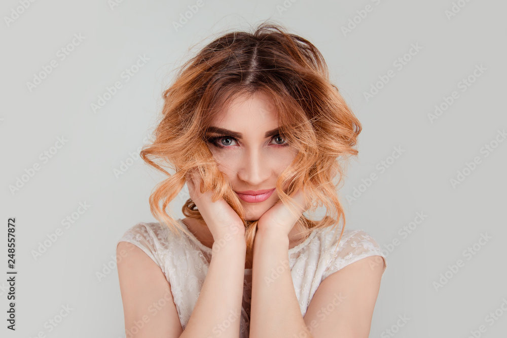 woman hands touching chin and hair posing flirting at camera woman hands touching chin and hair posing flirting at camera