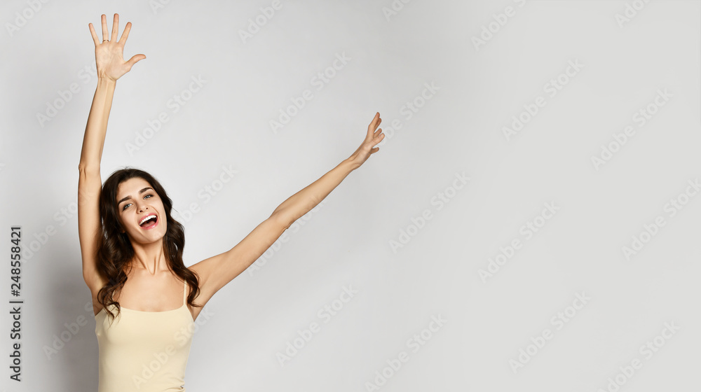 Young pretty girl winner celebrating happy smiling laughing with hands spreading up Young pretty girl winner celebrating happy smiling laughing with hands spreading up