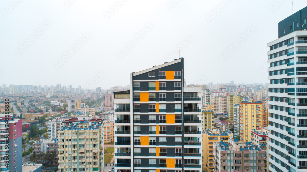 New multi-storey residential building apartment houses aerial view with swimming pool, basketball court and children playground. Mortgage background concept image.