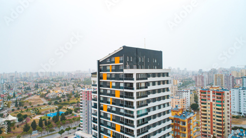 New multi-storey residential building apartment houses aerial view with swimming pool  basketball court and children playground. Mortgage background concept image.