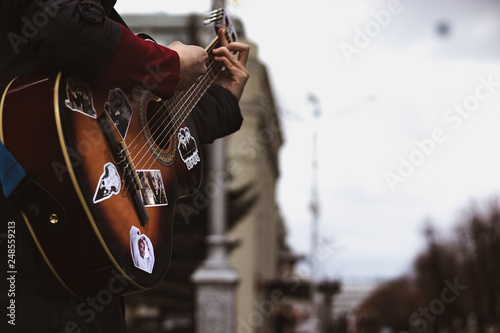 young man playing a guitar