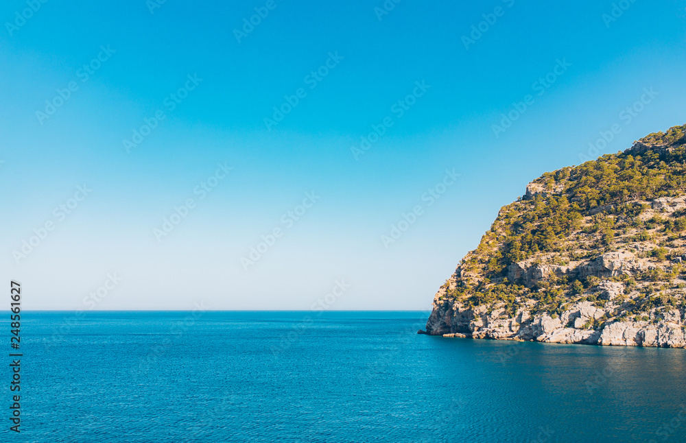 island and rocks in the sea or ocean