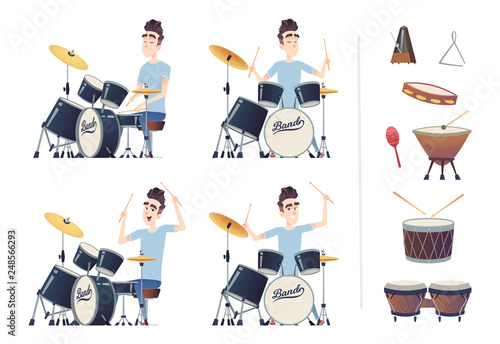 Young handsome guy playing the drums. A set of percussion instruments. Drummer practiced and trained