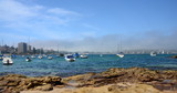 Yachts in North Harbour at Fourty Baskets Beach on a foggy day. Manly in the background.