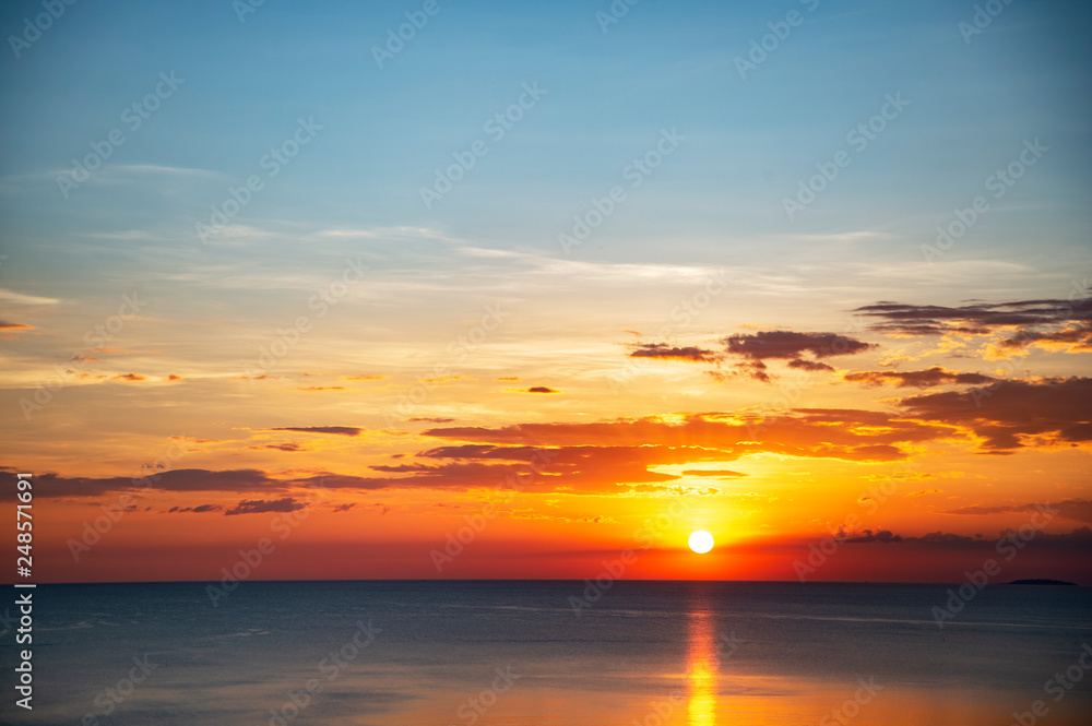 summer light cloudy blue sky at sunset on the sea coast for travel and vacation background