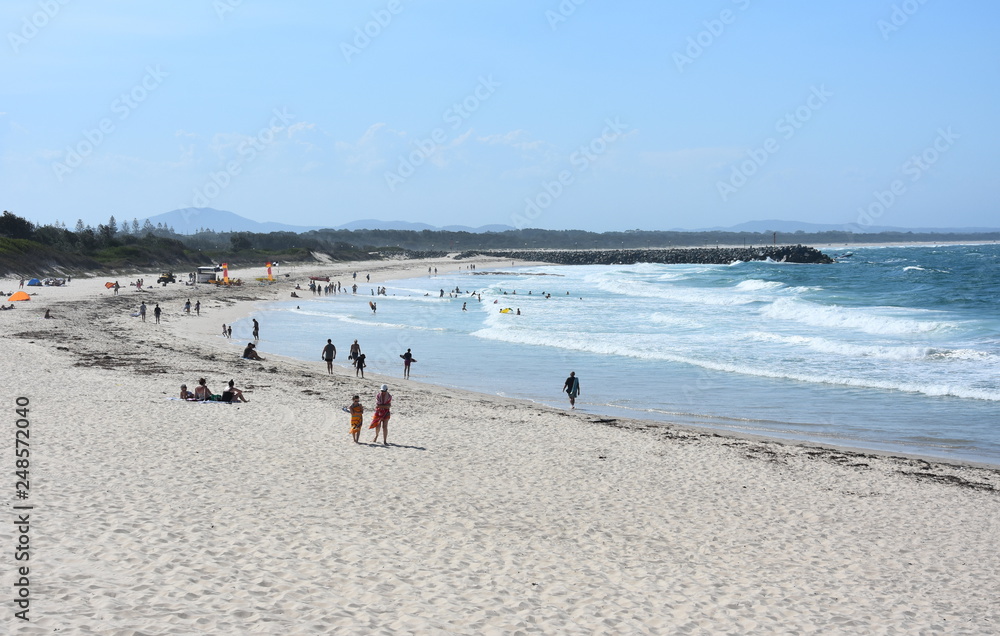 Forster, Australia - Jan 26, 2019. People relaxing at Forster Main beach on a hot sunday in summer time.