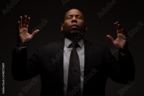 African American Christian Man Praying and Seeking Guidance from God