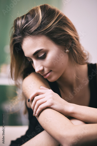 Portrait of young gorgeous woman on sofa, shallow depth of field