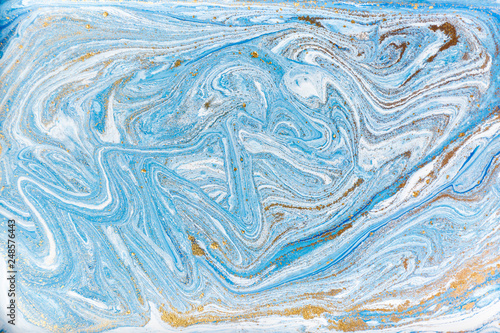 Blue and white marbling pattern with gold glitter. Marble liquid texture.