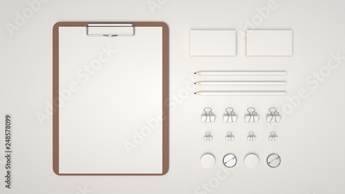 Clipboard, business cards, binder clips, badges and pencils photo