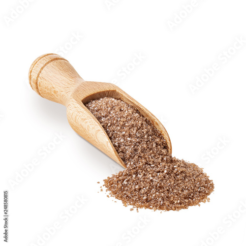Brown smoked salt in a wooden scoop isolated on white background