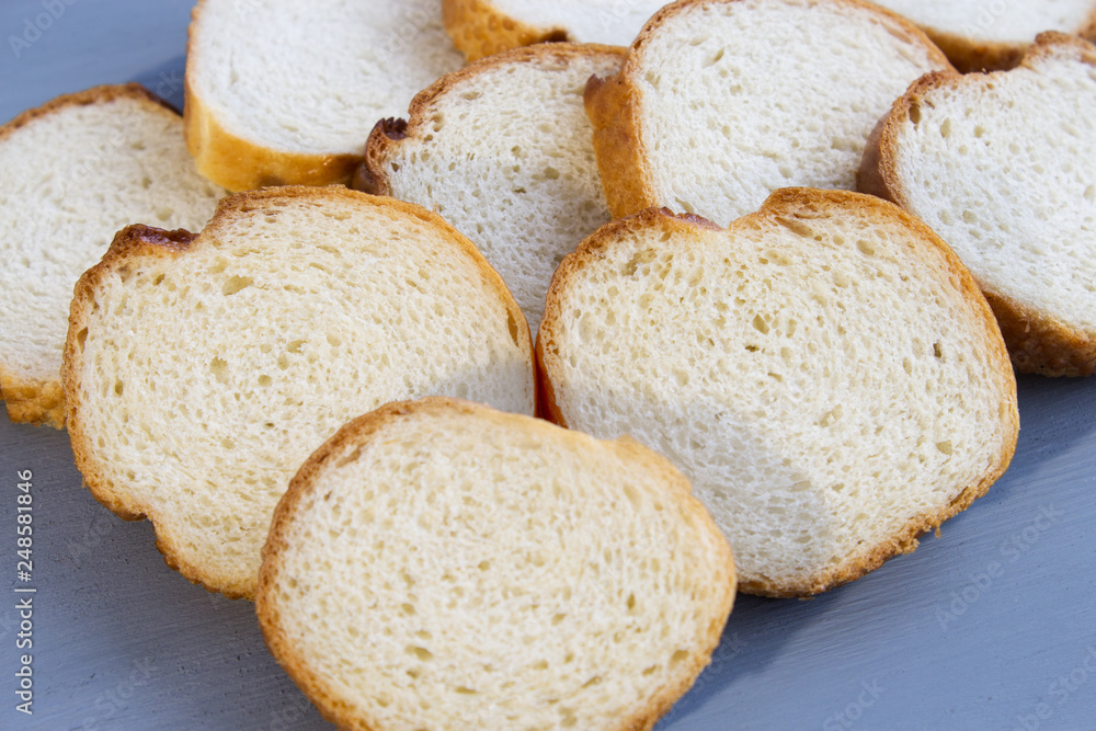 Slices of baguette. Baguette for breakfast. Close-up. Copy space. Slices of baguette. Baguette for breakfast. Close-up. Copy space.