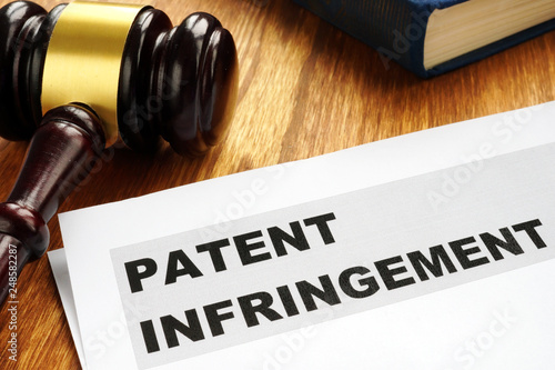 Patent infringement and gavel. Copyright law concept. photo
