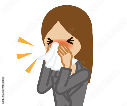 Businesswoman blowing nose with a tissue