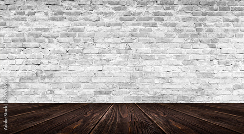 background of an empty white room  a cellar  lit by a searchlight. Brick white wall and wooden floor