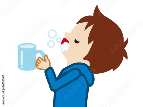 Toddler boy gargling with water for prevent cold