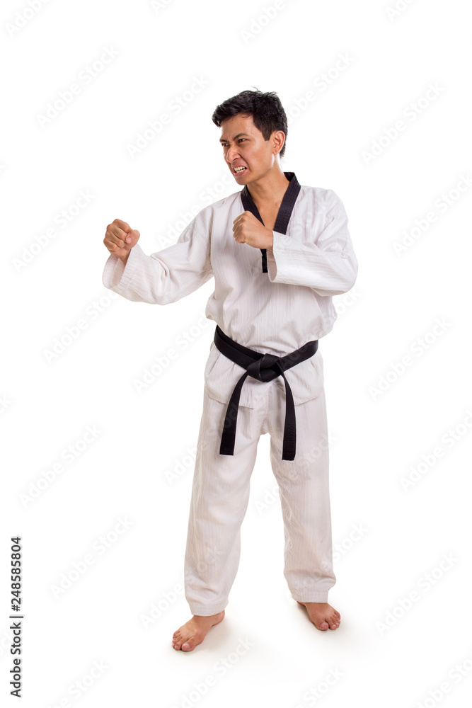 Portrait of karate guy expressing anger, full length studio shot Portrait of karate guy expressing anger, full length studio shot