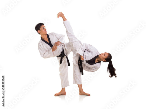 Young male and female taekwondo masters sparring session