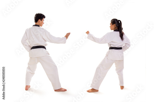 Back shot of two martial artists ready to fight, isolated background