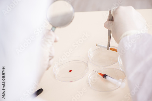 Young expert criminologist working in the lab © Elnur