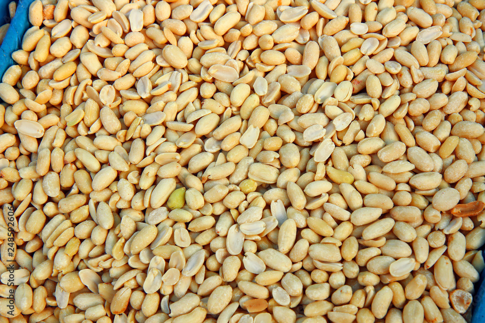 peeled raw peanuts in the market. pile of nuts peeled raw peanuts in the market. pile of nuts