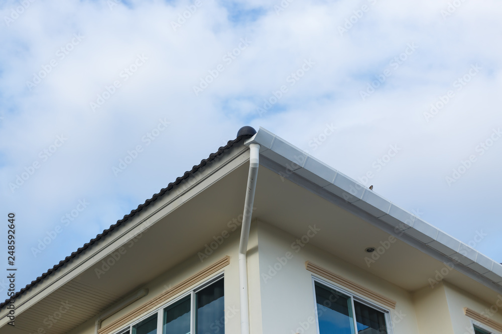 roof gutter on residential house building