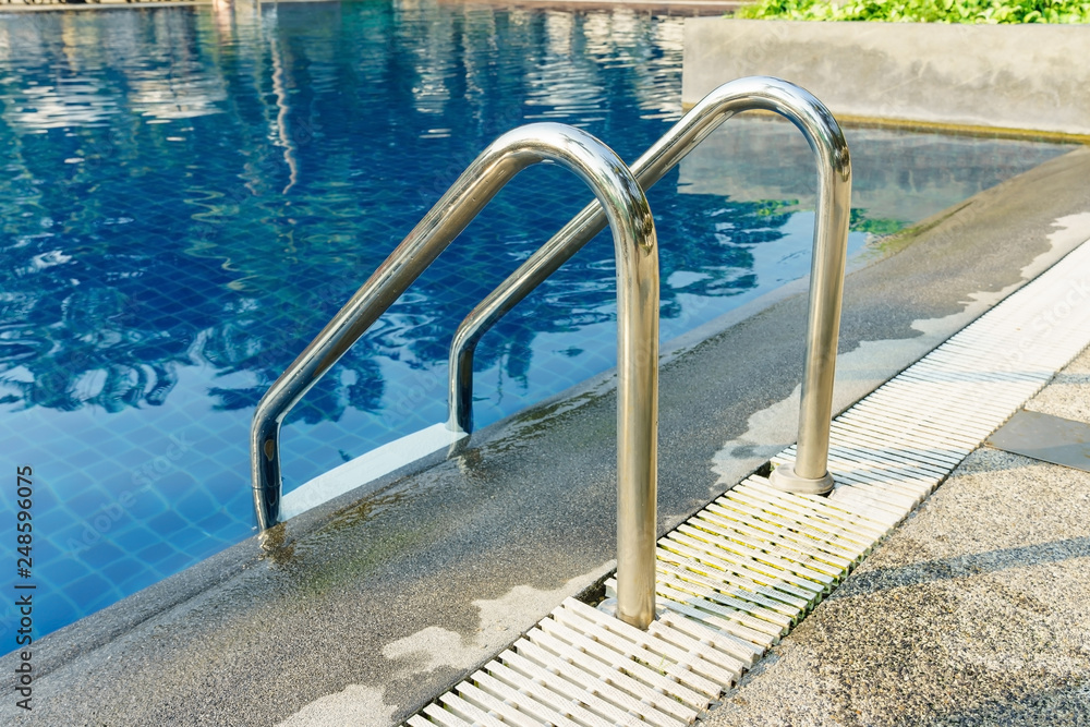 Swimming pool with handrails or ladder at hotel