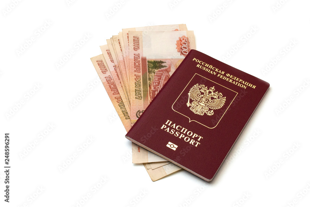 Isolated Russian passport and a pack of five thousandth ruble banknotes on white background Isolated Russian passport and a pack of five thousandth ruble banknotes on white background