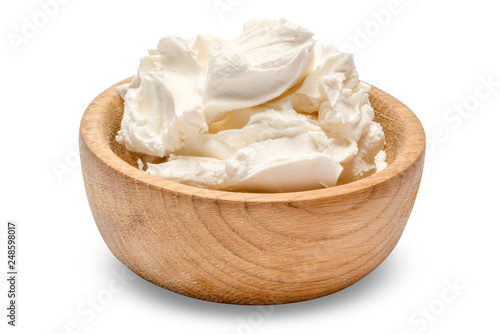Traditional Mascarpone cheese in wooden bowl isolated with clipping path