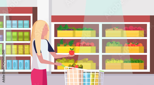 woman housewife carrying full trolley cart of food purchases big grocery shop supermarket interior female customer super market shopping concept portrait flat horizontal