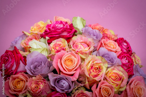 Beautiful bouquet of roses in a gift box. Bouquet of pink roses. Pink roses close-up. on pink background  with space for text.